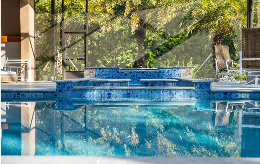 pool featuring a waterfall