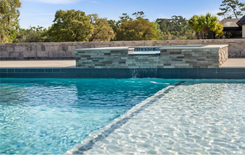 A pool with a waterfall feature