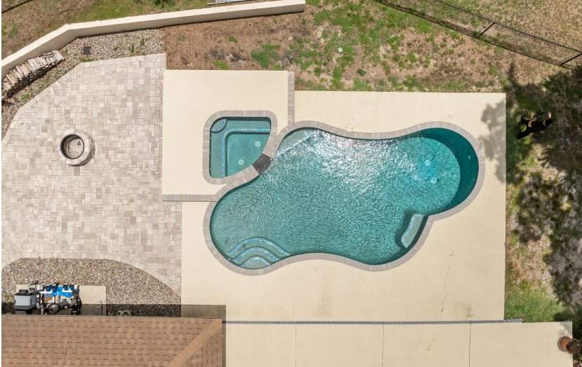 Aerial view of a pool and hot tub