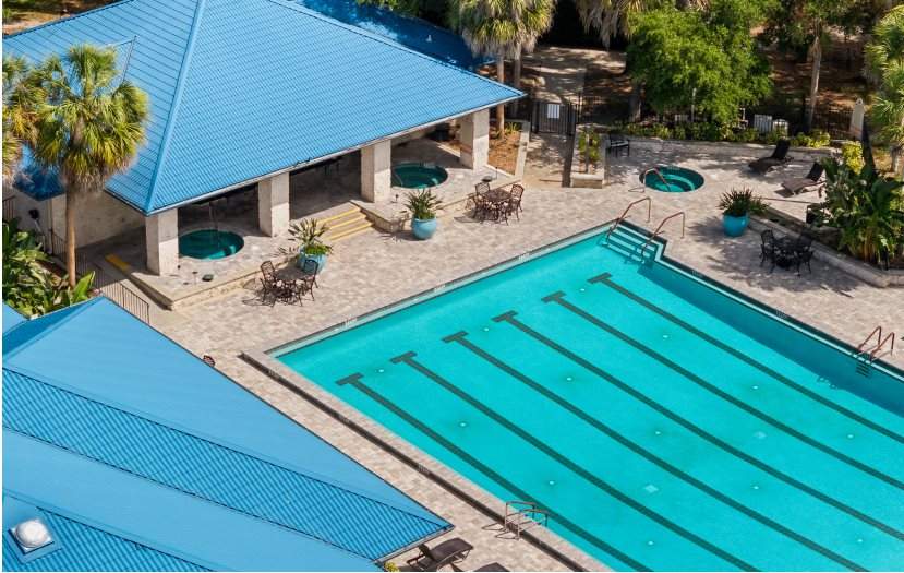 Aerial view of a lap pool surrounded by a patio area