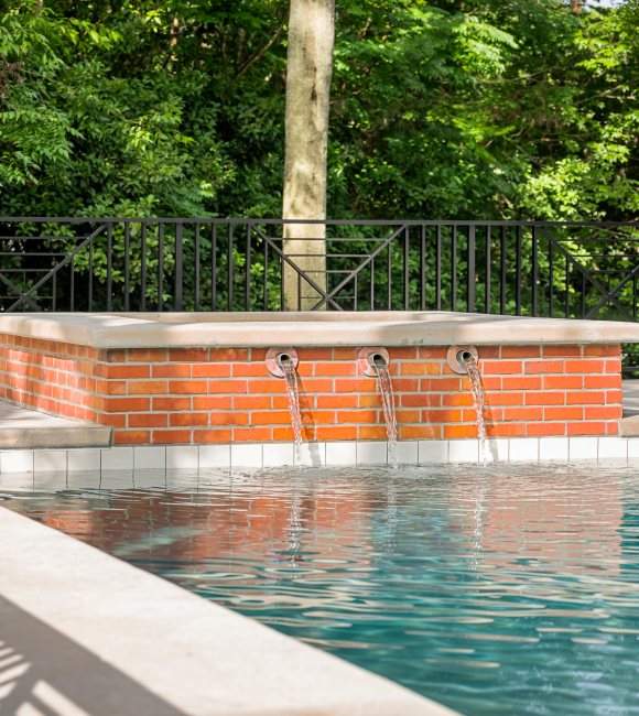 A pool with three waterfall features